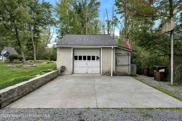 garage with a yard