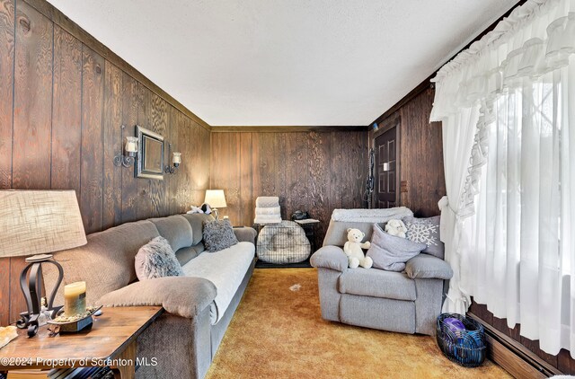 living room with wood walls and light carpet