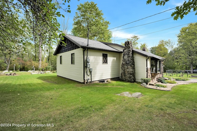 view of home's exterior featuring a lawn