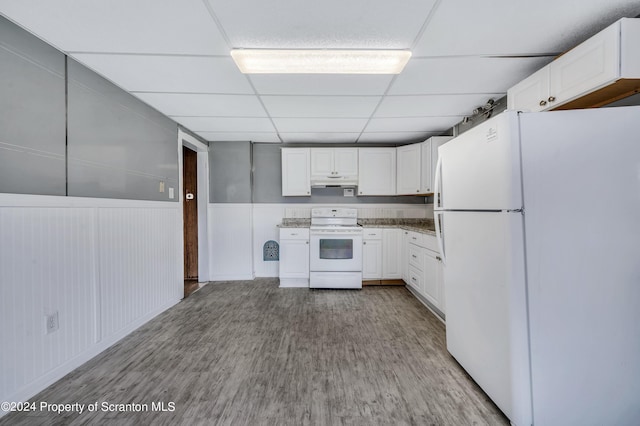 kitchen with a drop ceiling, white cabinetry, white appliances, and light hardwood / wood-style flooring