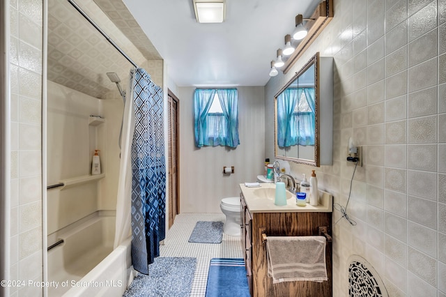 full bathroom featuring tile patterned flooring, vanity, tile walls, and shower / tub combo with curtain