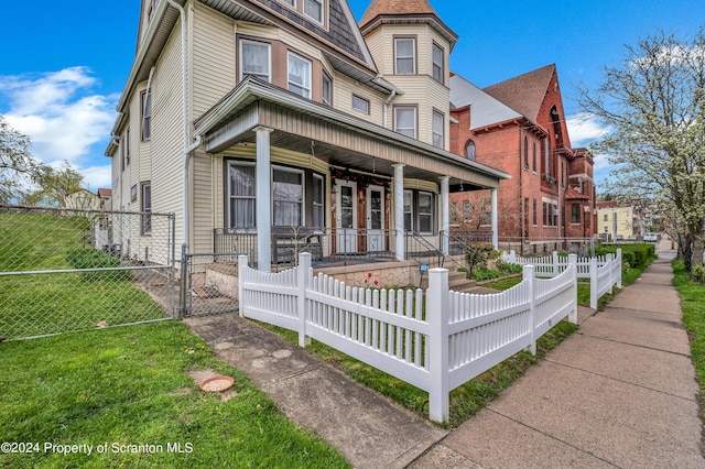 victorian house featuring covered porch