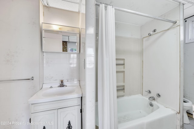 full bathroom with shower / bath combination with curtain, toilet, and vanity