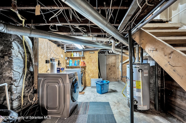 basement with washer and clothes dryer and gas water heater