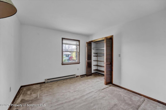 906 Violet Ter, Clarks Summit, PA 18411 - unfurnished bedroom featuring a closet, baseboards, carpet, and a baseboard radiator