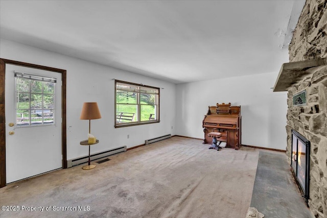 906 Violet Ter, Clarks Summit, PA 18411 - living room featuring a stone fireplace and baseboard heating