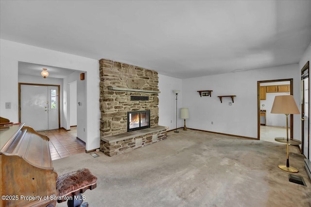906 Violet Ter, Clarks Summit, PA 18411 - unfurnished living room featuring carpet flooring, baseboards, and a fireplace