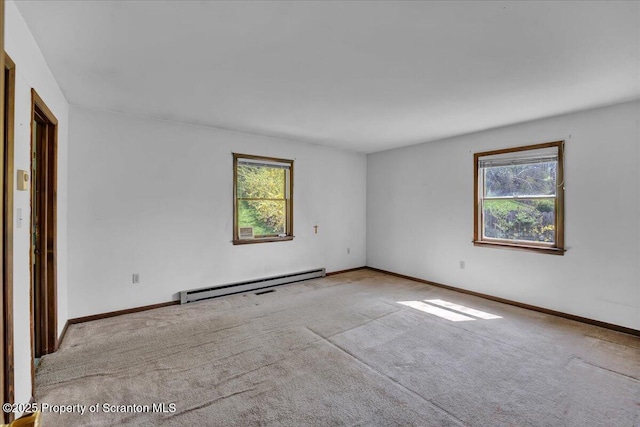 906 Violet Ter, Clarks Summit, PA 18411 - carpeted spare room featuring baseboards, a baseboard radiator, and a wealth of natural light