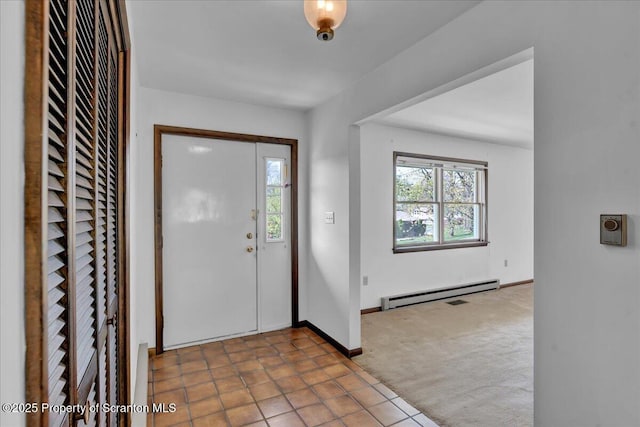 906 Violet Ter, Clarks Summit, PA 18411 - foyer featuring carpet floors, baseboards, and a baseboard heating unit