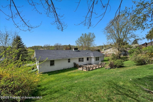 906 Violet Ter, Clarks Summit, PA 18411 - rear view of property featuring a lawn, a deck, and a chimney