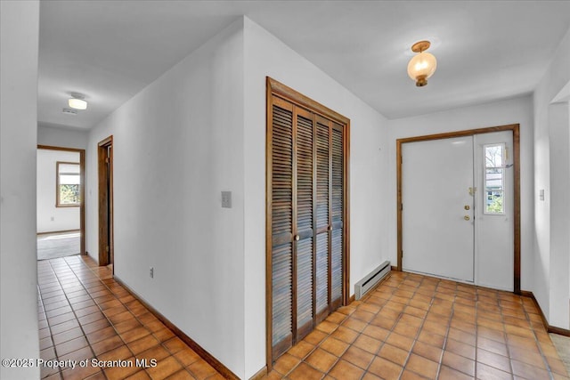 906 Violet Ter, Clarks Summit, PA 18411 - entryway with a healthy amount of sunlight, baseboards, and baseboard heating