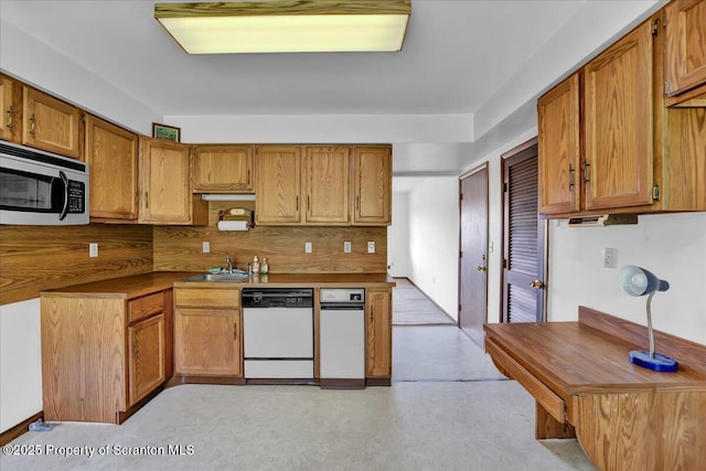 906 Violet Ter, Clarks Summit, PA 18411 - kitchen featuring brown cabinets, stainless steel microwave, a sink, and dishwasher
