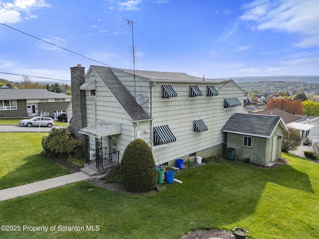 817 Miles Ave, Dickson City, PA 18447 - exterior space with a lawn, roof with shingles, a chimney, and an outbuilding