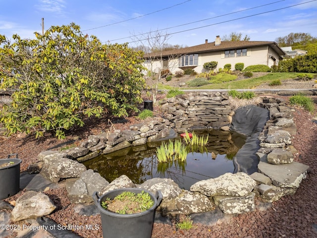 817 Miles Ave, Dickson City, PA 18447 - exterior space with a garden pond