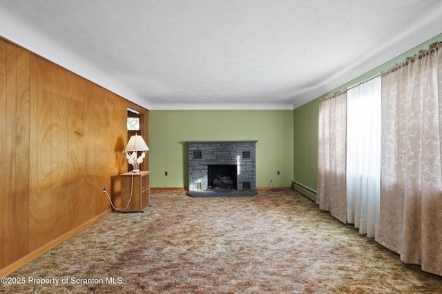 817 Miles Ave, Dickson City, PA 18447 - unfurnished living room featuring carpet, a fireplace with raised hearth, baseboard heating, and baseboards