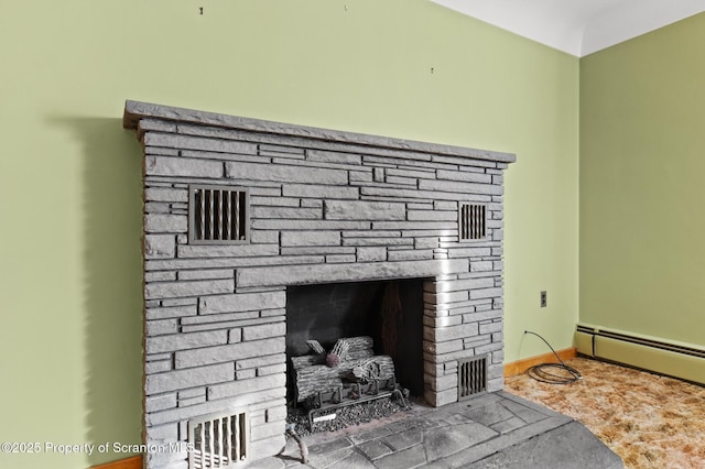 817 Miles Ave, Dickson City, PA 18447 - details with baseboard heating, visible vents, and a stone fireplace