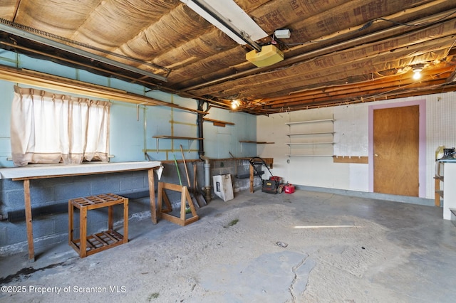 817 Miles Ave, Dickson City, PA 18447 - garage with a workshop area and a garage door opener