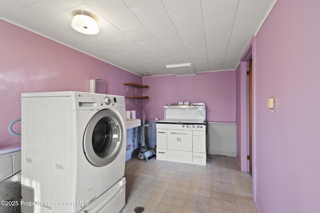 817 Miles Ave, Dickson City, PA 18447 - washroom featuring light floors, washer / dryer, laundry area, and wainscoting