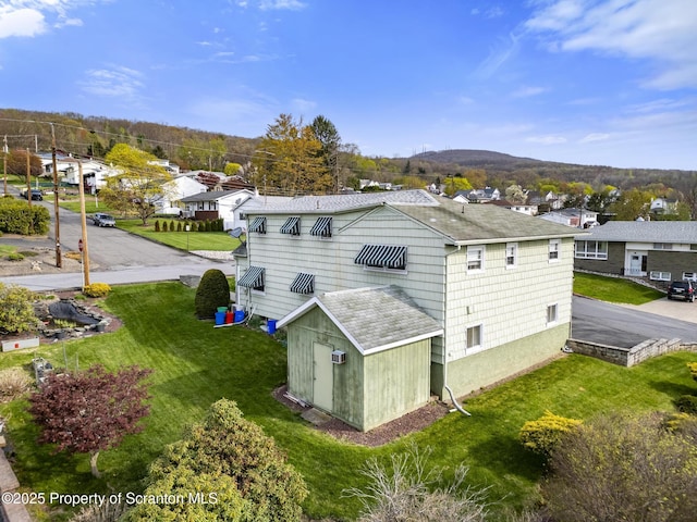 817 Miles Ave, Dickson City, PA 18447 - exterior space featuring a residential view, a lawn, a mountain view, and roof with shingles