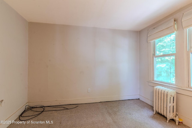 51 Plank St, Pittston, PA 18640 - unfurnished room with radiator heating unit and light colored carpet