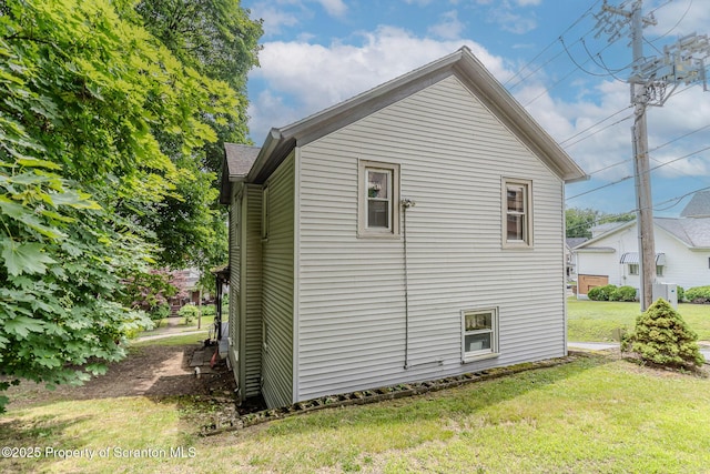 51 Plank St, Pittston, PA 18640 - view of side of property with a lawn and an ac unit