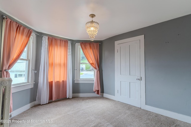 51 Plank St, Pittston, PA 18640 - unfurnished bedroom with carpet flooring and a chandelier