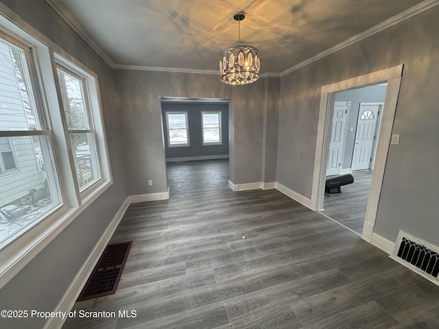 unfurnished dining area with an inviting chandelier, visible vents, dark wood-style flooring, and ornamental molding