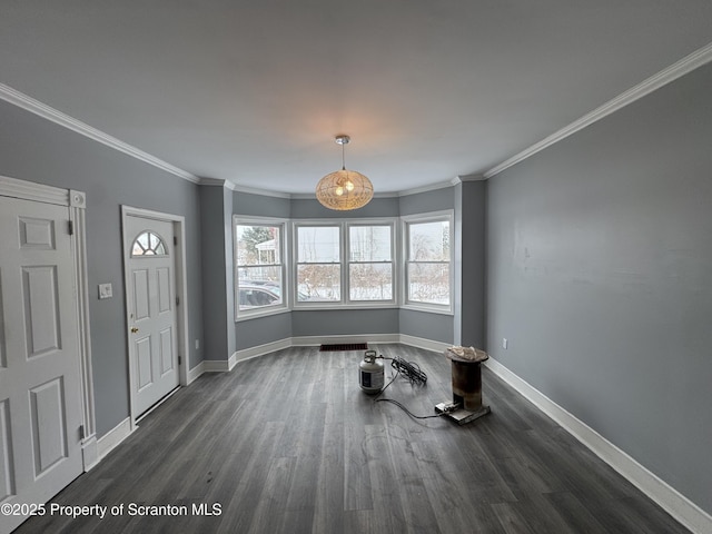 entryway featuring dark hardwood / wood-style flooring and ornamental molding