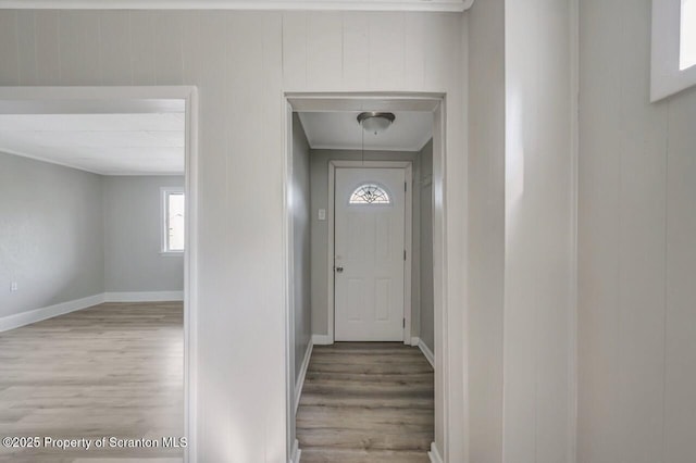 446 10th Ave, Scranton, PA 18504 - doorway with wood finished floors and crown molding