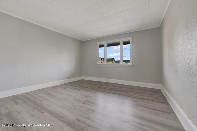 446 10th Ave, Scranton, PA 18504 - empty room featuring wood finished floors and crown molding