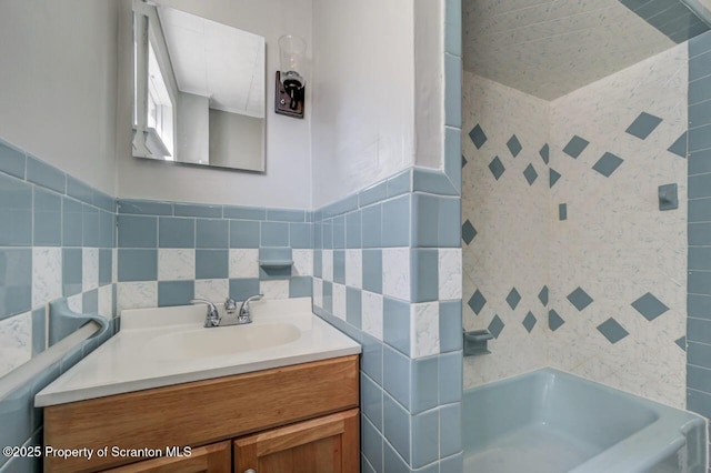 446 10th Ave, Scranton, PA 18504 - bathroom with tile walls, vanity, and bathing tub / shower combination