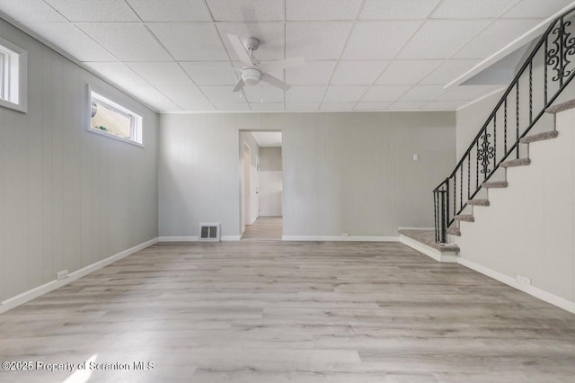 446 10th Ave, Scranton, PA 18504 - basement with light wood-style flooring, a ceiling fan, stairs, and a paneled ceiling