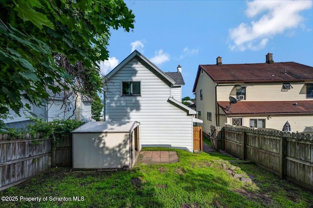 446 10th Ave, Scranton, PA 18504 - rear view of house with a fenced backyard and a storage unit