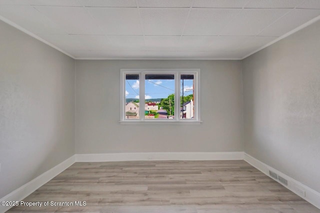 446 10th Ave, Scranton, PA 18504 - empty room with ornamental molding and light wood-style floors