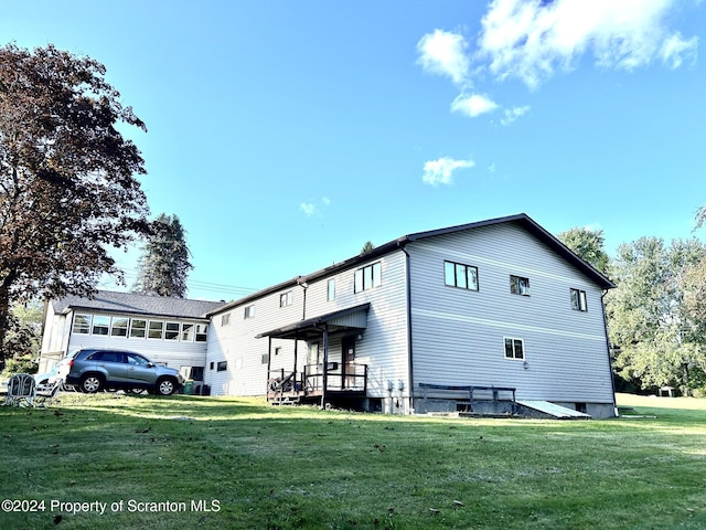 view of side of property with a yard