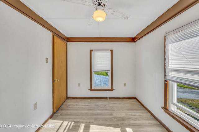 spare room with ceiling fan and light hardwood / wood-style floors