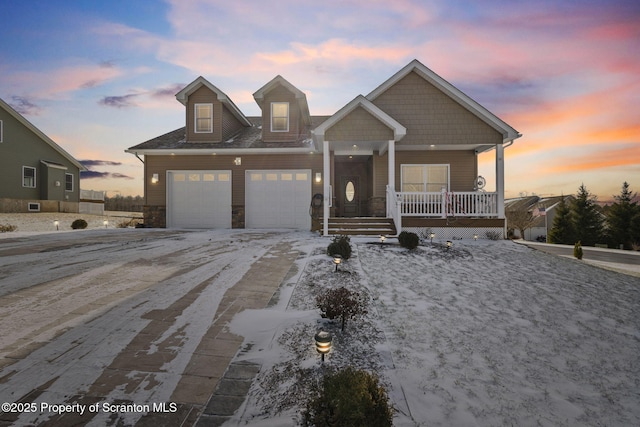 view of front of house featuring a garage and covered porch