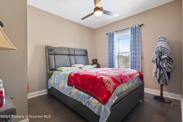 bedroom featuring dark hardwood / wood-style floors and ceiling fan