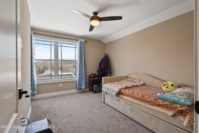 carpeted bedroom with ceiling fan and lofted ceiling