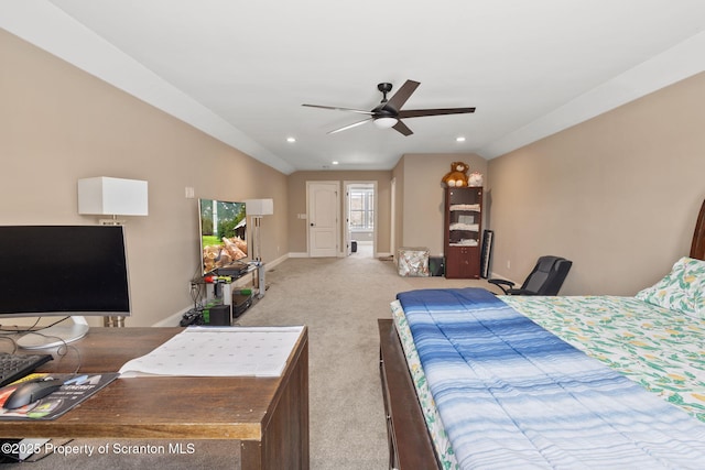 bedroom with ceiling fan, light colored carpet, and vaulted ceiling