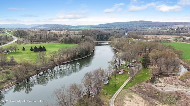 drone / aerial view with a water and mountain view