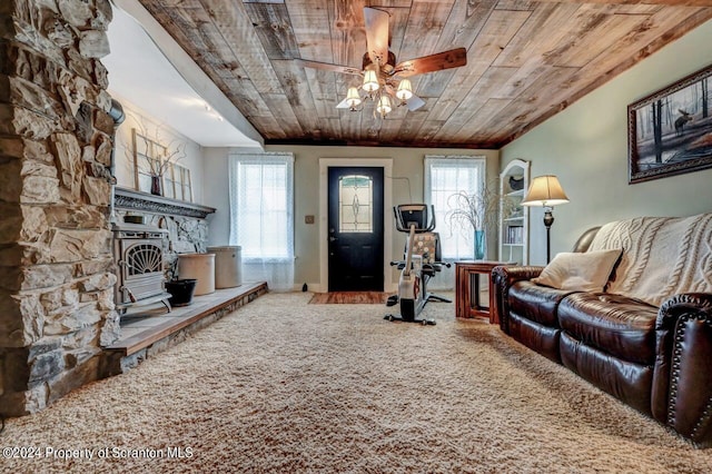 living room with carpet, a fireplace, ceiling fan, and wooden ceiling