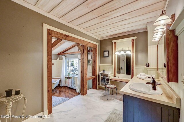 bathroom featuring wooden ceiling and sink