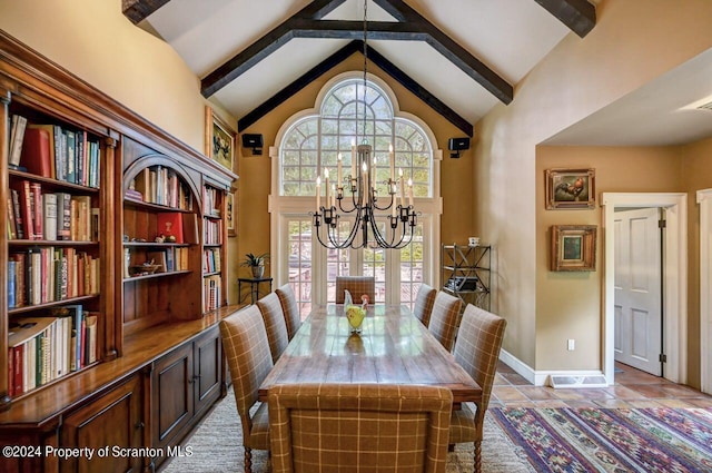 tiled dining area featuring high vaulted ceiling, an inviting chandelier, and plenty of natural light