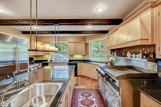 kitchen featuring beam ceiling, dishwasher, sink, hanging light fixtures, and light brown cabinetry