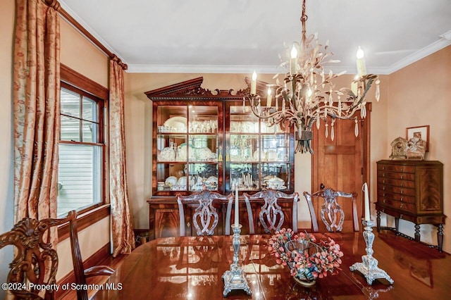 dining area with a notable chandelier and crown molding