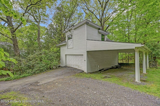 view of side of home featuring a garage