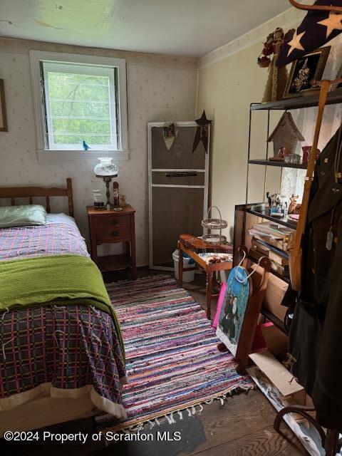 bedroom featuring hardwood / wood-style floors