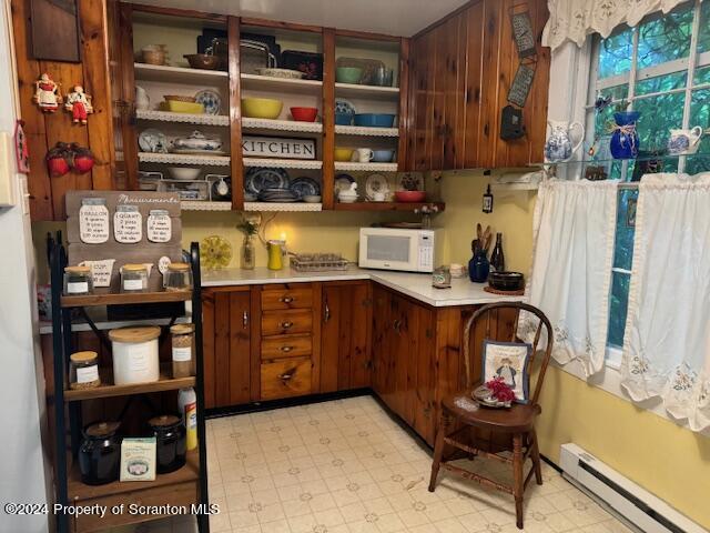 pantry featuring a baseboard radiator