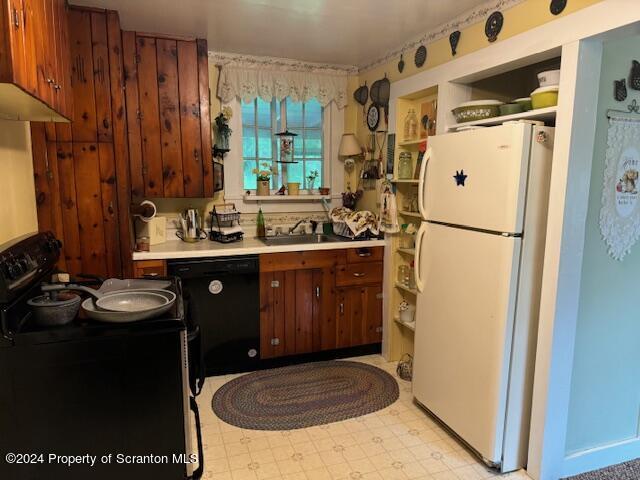 kitchen featuring black appliances and sink